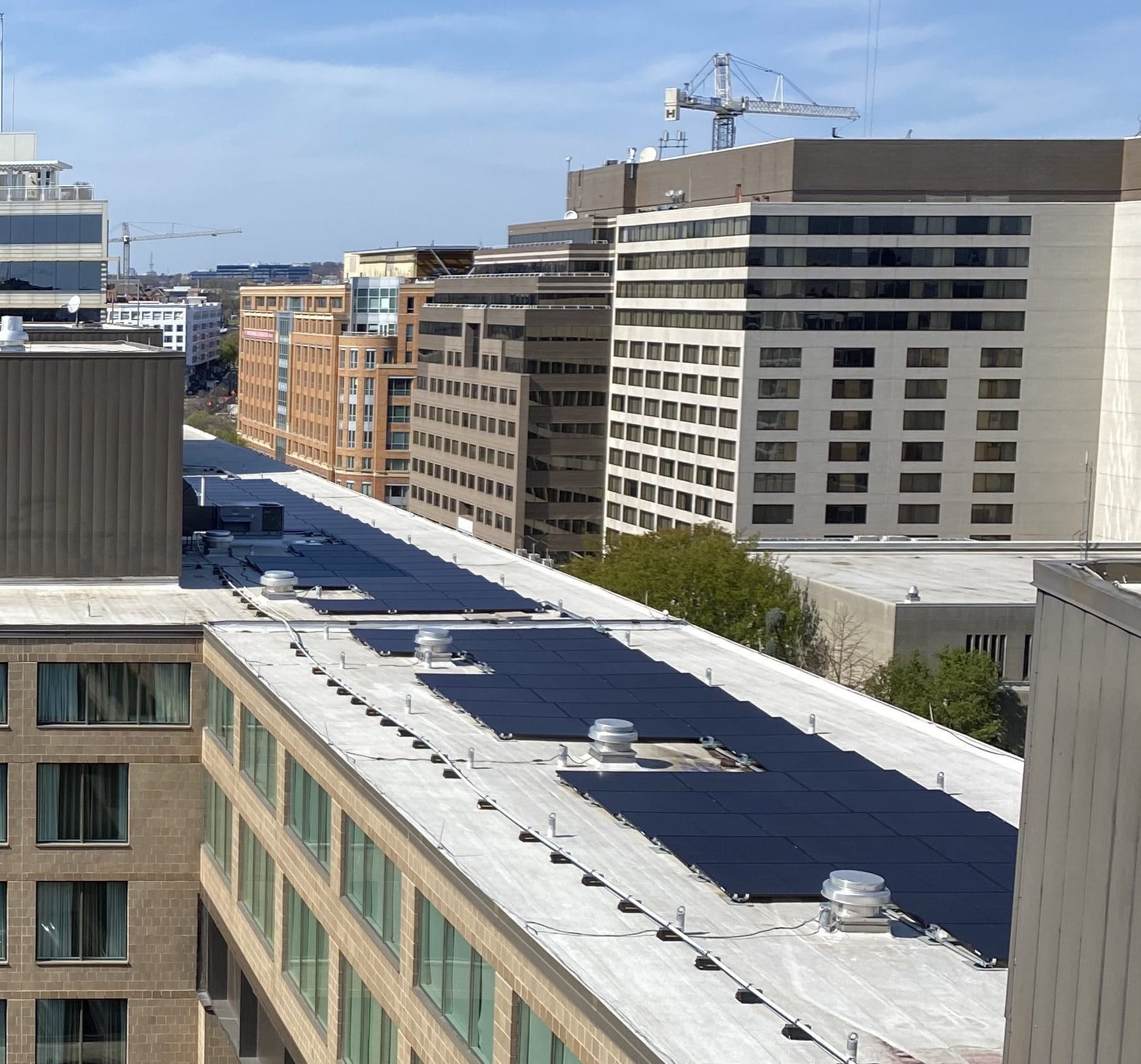 Hotel near Capitol Hill with rooftop solar installed by Aurora Energy